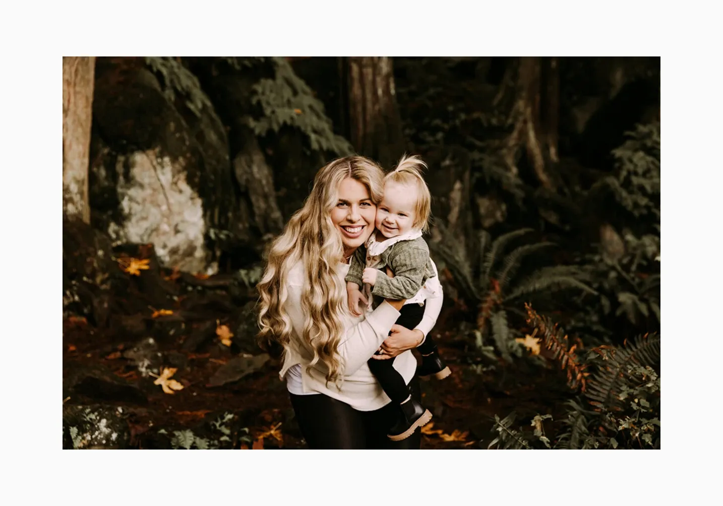 Joyful mother and daughter portrait in a forest setting with natural light, showcasing outdoor family photography and authentic moments - photographed by Bri'Anne Elizabeth Photography
