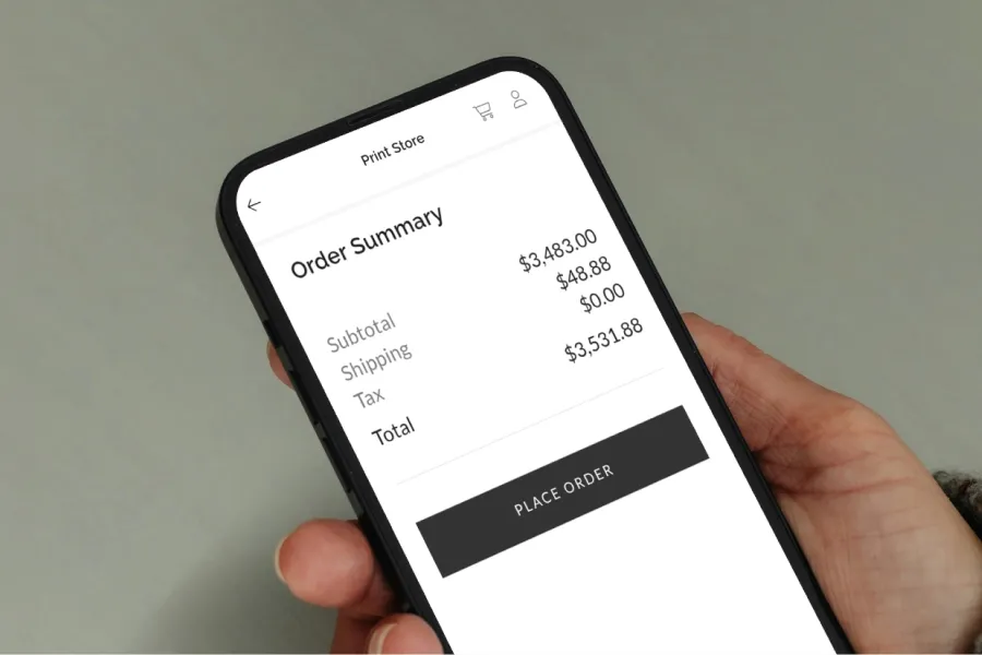 Order summary screen on mobile device showing total purchase amount for print store order.