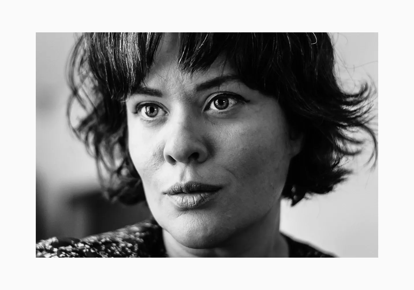 Artistic black and white close-up portrait of woman with expressive eyes, ideal for editorial or fine art photography portfolio - photographed by Amy Harper